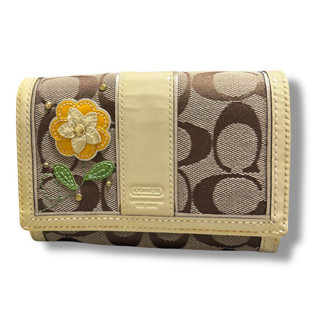 COACH コーチ 花柄 二つ折り財布 折財布 シグネチャー イエロー 金運