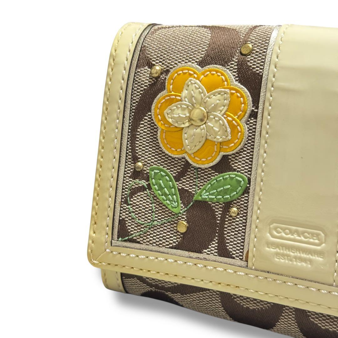 COACH コーチ 花柄 二つ折り財布 折財布 シグネチャー イエロー 金運