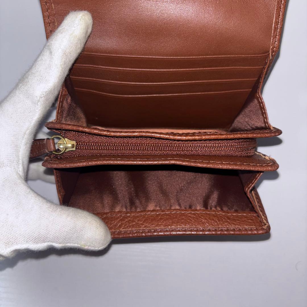 0077 新品、未使用 COACH レザー 金馬車ロゴ 折り財布