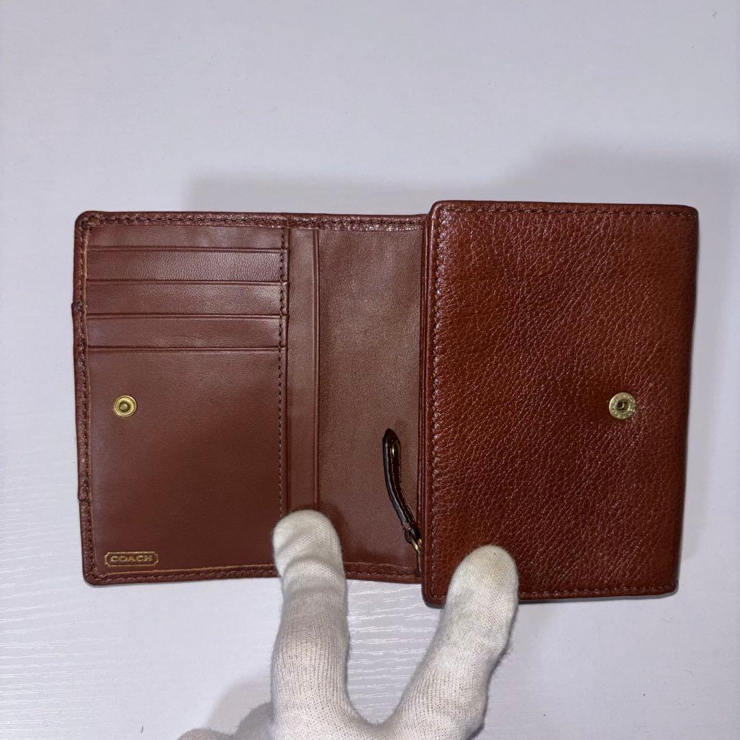 0077 新品、未使用 COACH レザー 金馬車ロゴ 折り財布