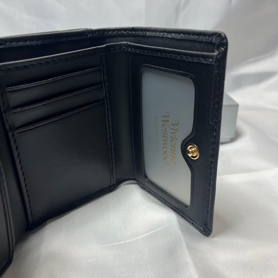 新品 Vivienne Westwood 黒ヴィヴィアン柄 三つ折り財布 人気