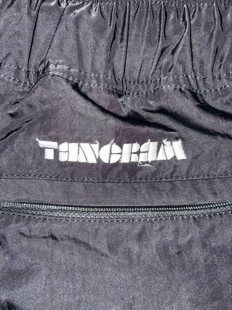 TANGRAM ブラックナイロンパンツ