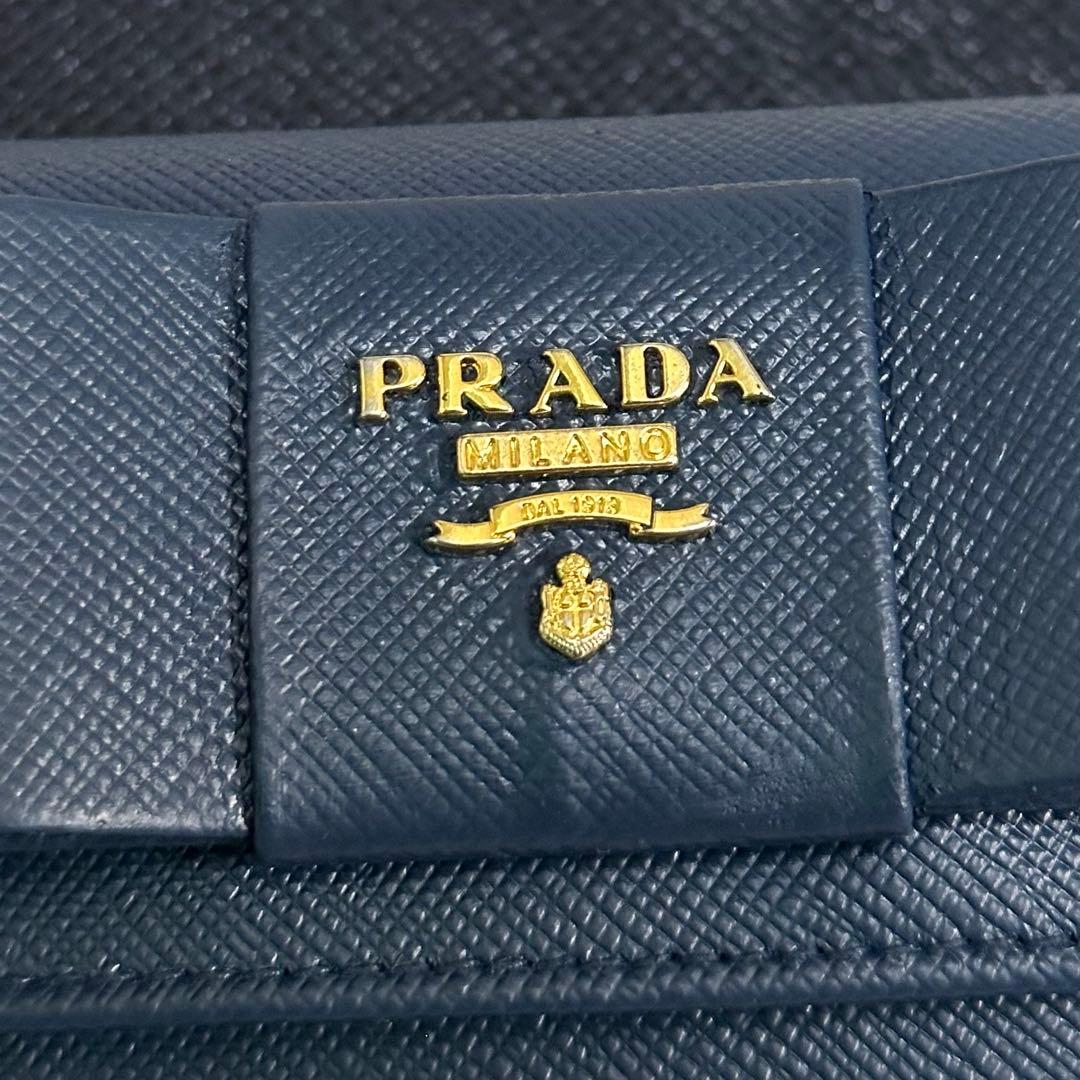 PRADA プラダ　折り財布　リボン　ゴールドロゴ ブルー　サフィアーノレザー